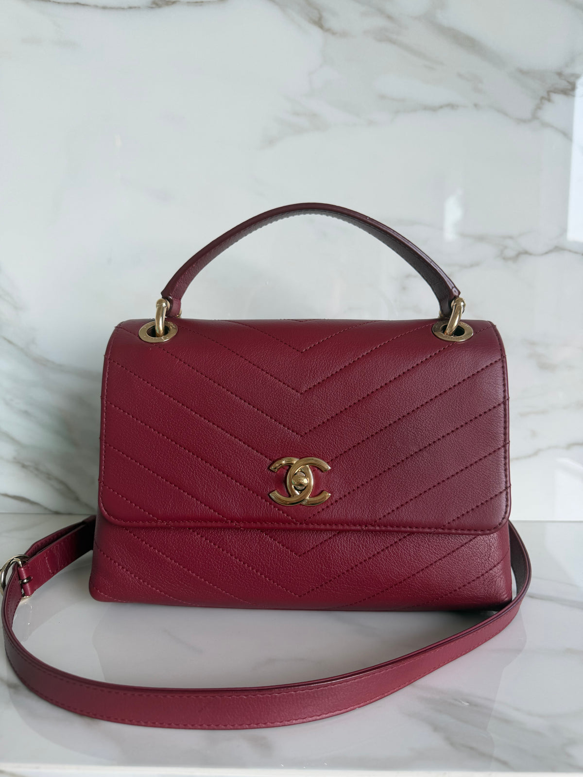 TOP HANDLE CHEVRON BAG IN BURGUNDY CALFSKIN