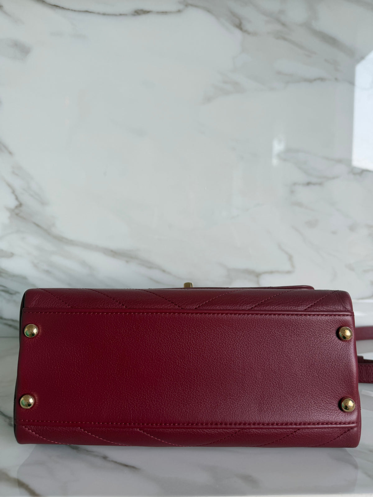 TOP HANDLE CHEVRON BAG IN BURGUNDY CALFSKIN