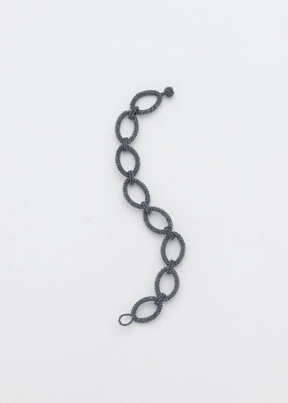 BRAZALETE AROS TAWARI GRIS METALICO